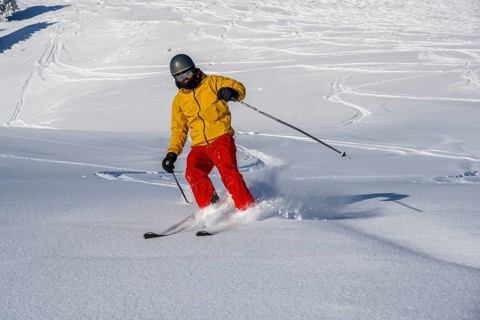 Skiers in deep snow