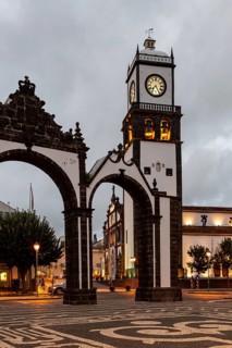 Portas da Cidade gates with the church of St. Sebastian in the evening