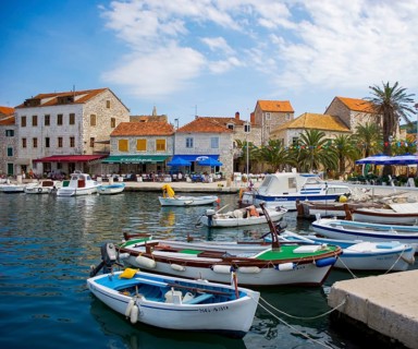 Promenade with fishing boats in the port