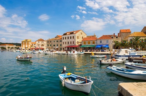 Promenade with fishing boats in the port