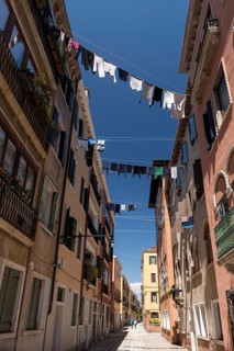 Laundry drying on clotheslines stretched between houses