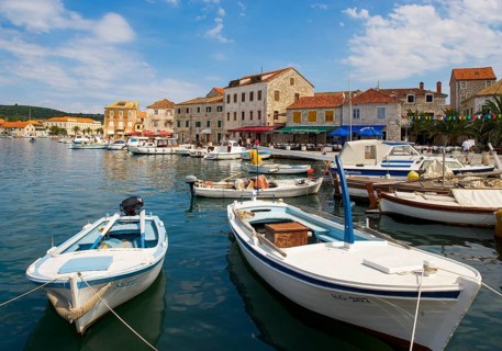 Promenade with fishing boats in the port