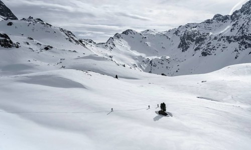 Ski tourers cross a flat slope