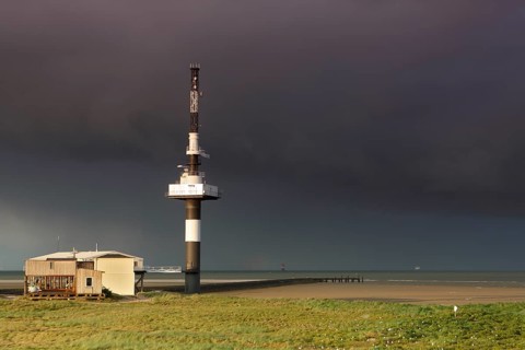 Radar tower on the Minsener Oog power plant in a bad weather front