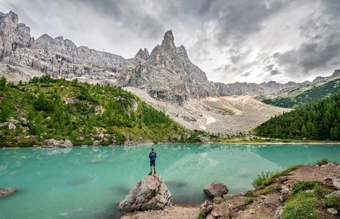 Young man standing on stone