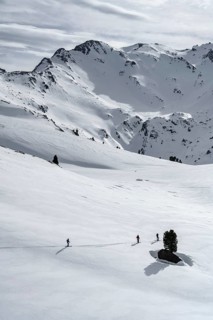 Ski tourers cross a flat slope