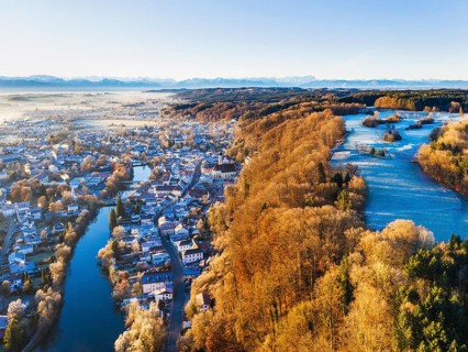 Wolfratshausen with Loisach and mountain forest in winter
