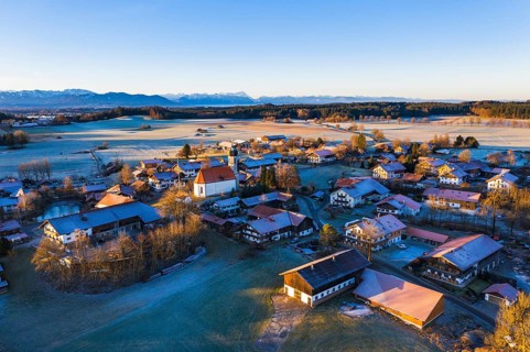 Village Lochen with church St. Magdalena in the morning light