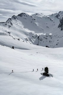 Ski tourers cross a flat slope