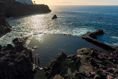 Natural pool in the Atlantic ocean at sunset