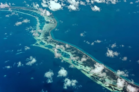Outer reef with large dredged sand areas for land reclamation elsewhere