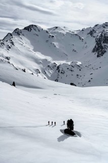 Ski tourers cross a flat slope