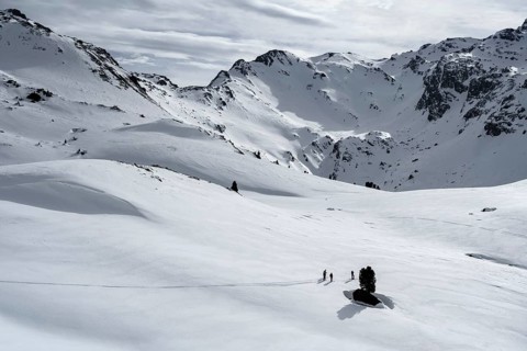 Ski tourers cross a flat slope