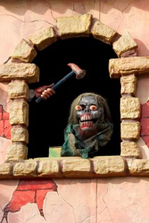 Horror figure in window on ghost train at the Wiesn