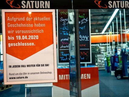 Sign at a Saturn consumer electronics store