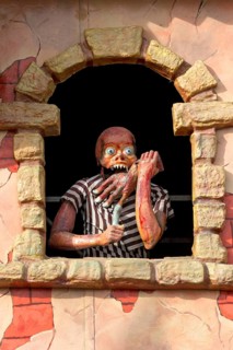Horror figure in window on ghost train at the Wiesn