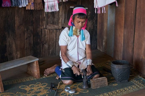 Padaung ethnic group woman making bracelets near Pan Pet village