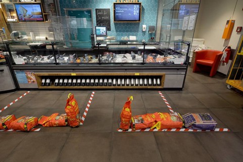 Barriers in supermarket for social distancing at fish counter