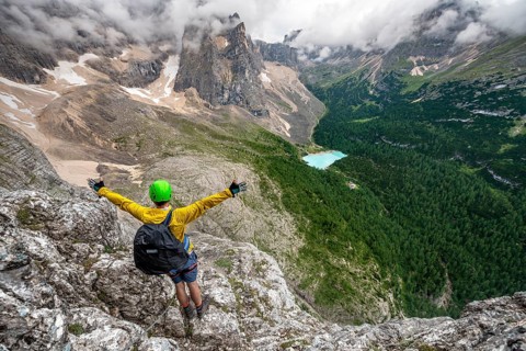 Young man puts his hands in the air