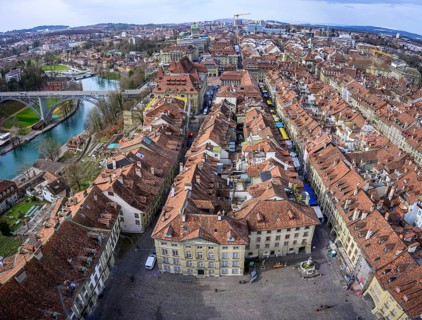 View from the Bernese Minster to the Muensterplatz and the red tiled roofs of the houses in the historic centre of the old town