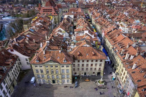 View from the Bernese Minster to the Muensterplatz and the red tiled roofs of the houses in the historic centre of the old town