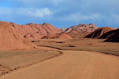 Road through red rock formations