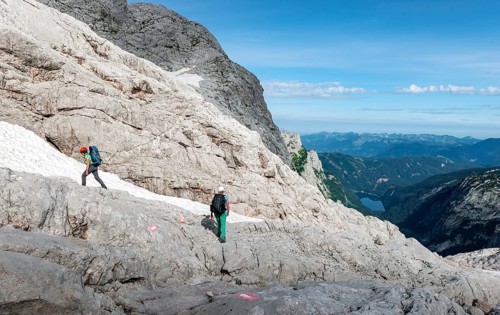 Female mountaineers on a marked route through rocky alpine terrain