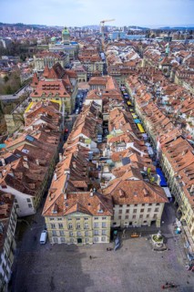 View from the Bernese Minster to the Muensterplatz and the red tiled roofs of the houses in the historic centre of the old town