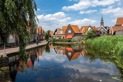Houses on the canal and church of St. Vincentius