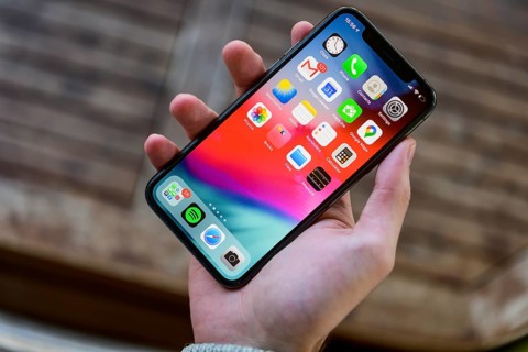 Hand holding iPhone 11