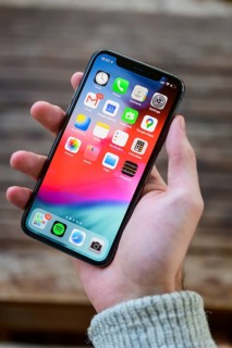 Hand holding iPhone 11