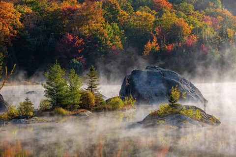 Early morning mist on lake in Autumn