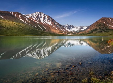 Altai Mountains reflected in the mountain lake