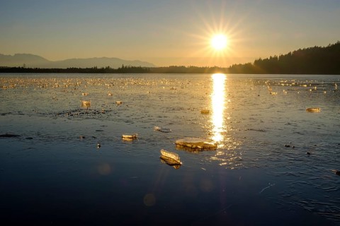 Small ice floes on frozen lake in winter