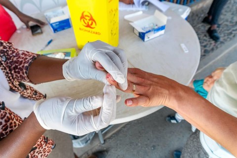 Nurse does a quick malaria test from blood on the South Africa and Mozambique border Lebombo Border Control