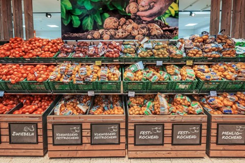 Shelf with onions and potatoes
