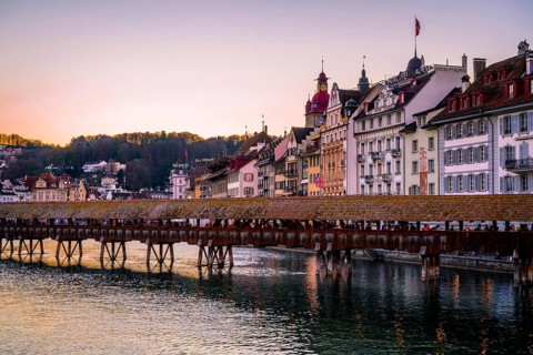 View over the river Reuss to the Chapel Bridge at sunset