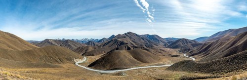 Barren mountain landscape with pass road, Lindis Pass