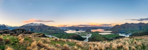 Sunset, panorama view on Wanaka Lake and mountains