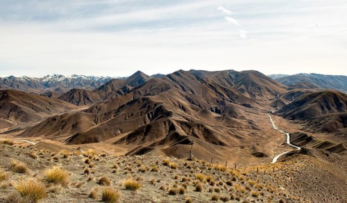 Stark mountain landscape with mountain road, Lindis Pass
