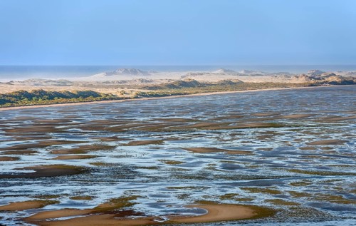 Coastal landscape, beach lagoon with sand dunes