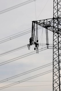 High voltage engineers working on high voltage pylons, Baden-Wuerttemberg