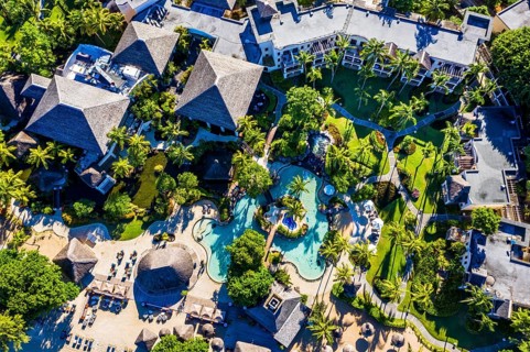 Beach of Flic en Flac with the luxury hotel Sugar Beach Golf & Spa Resort and palm trees, Mauritius