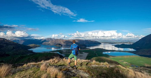 Hiker is looking out for Wanaka Lake and mountains, Rocky Peak