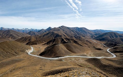 Barren mountain landscape with pass road, Lindis Pass