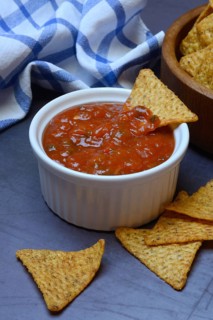 Salsa sauce in shell and tortilla chips, food photography
