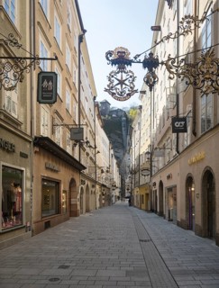 Vacant places due to the coronavirus pandemic, Getreidegasse with Buergerspitalskirche