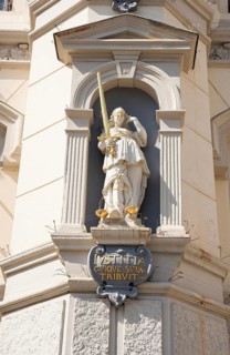 Figure of Justitia with sword, scales and blindfold