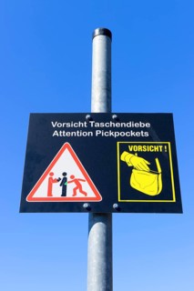 Plaque with a warning sign for pickpockets, Berlin