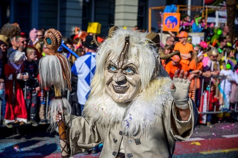 Masked woman with mask, Carnival parade of the Wey Guild on Rosenmontag